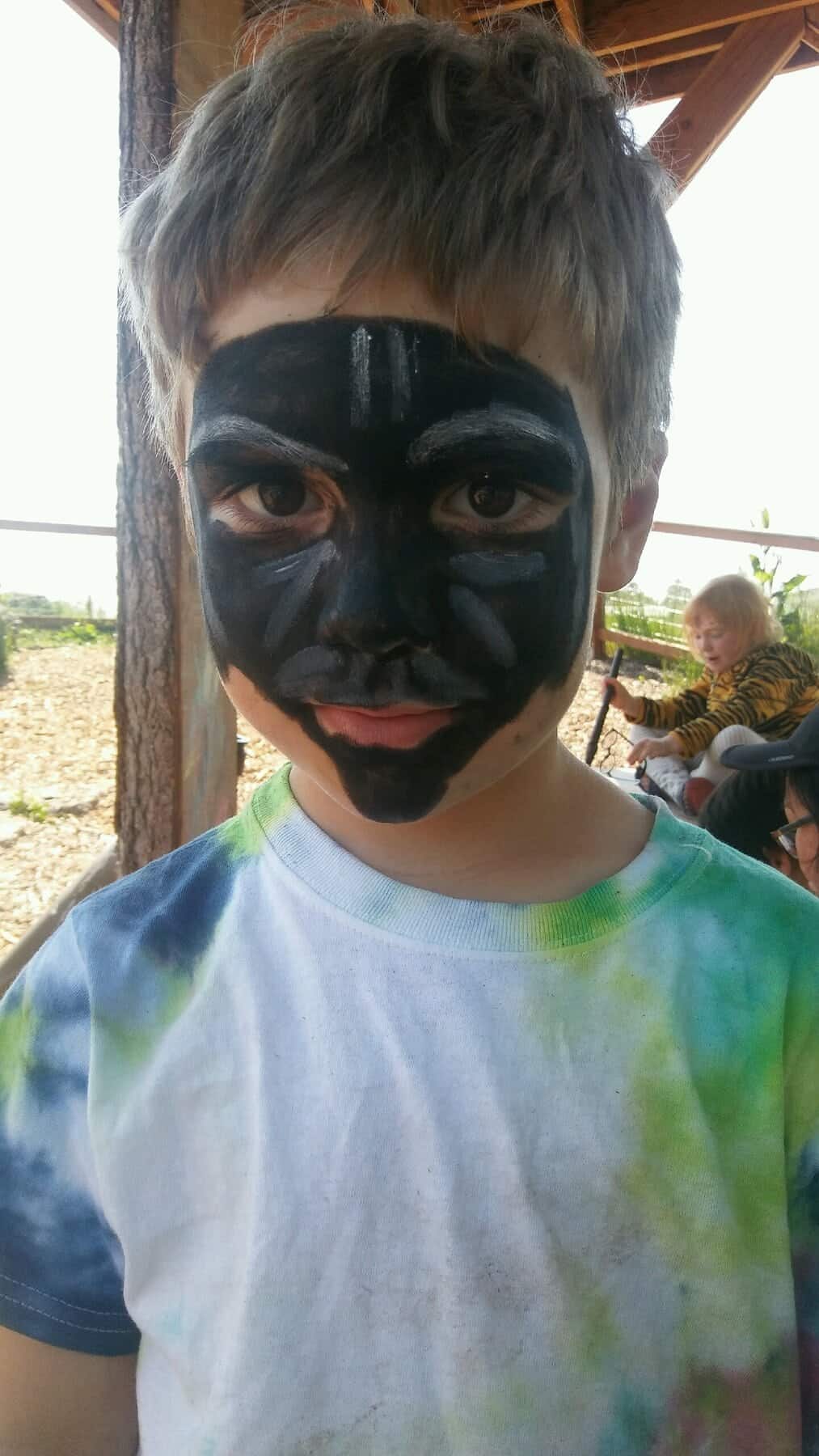 Child with face painted