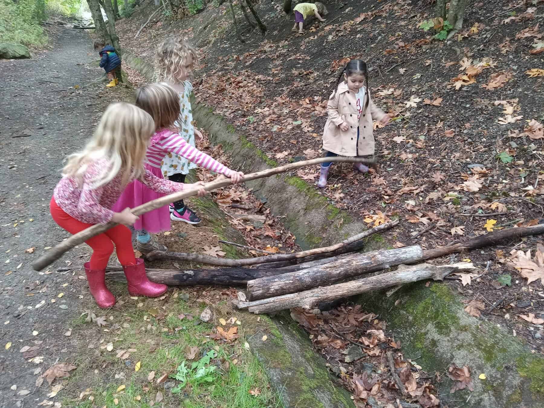 Children playing with wooden sticks